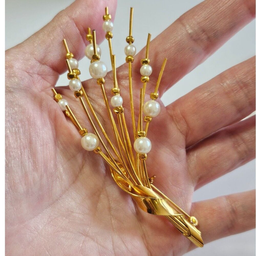 Gold tone faux pearl spray brooch